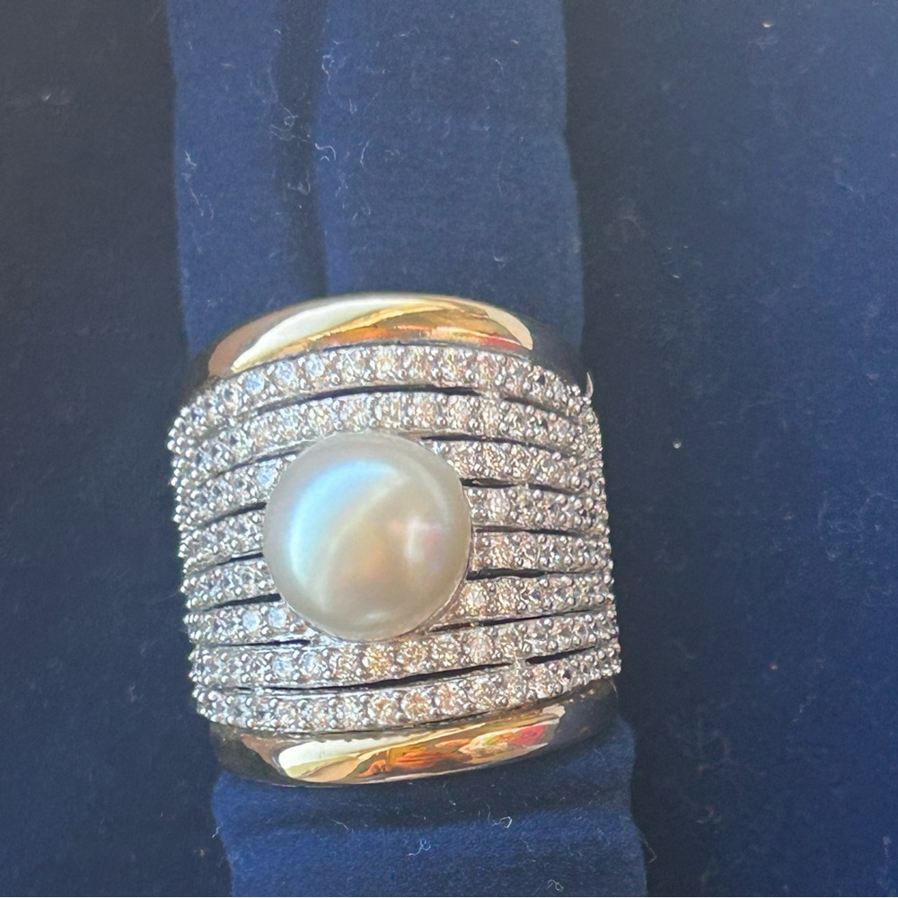 New ring of 925 rhodium-plated sterling silver and 18-carat gold with zircons,